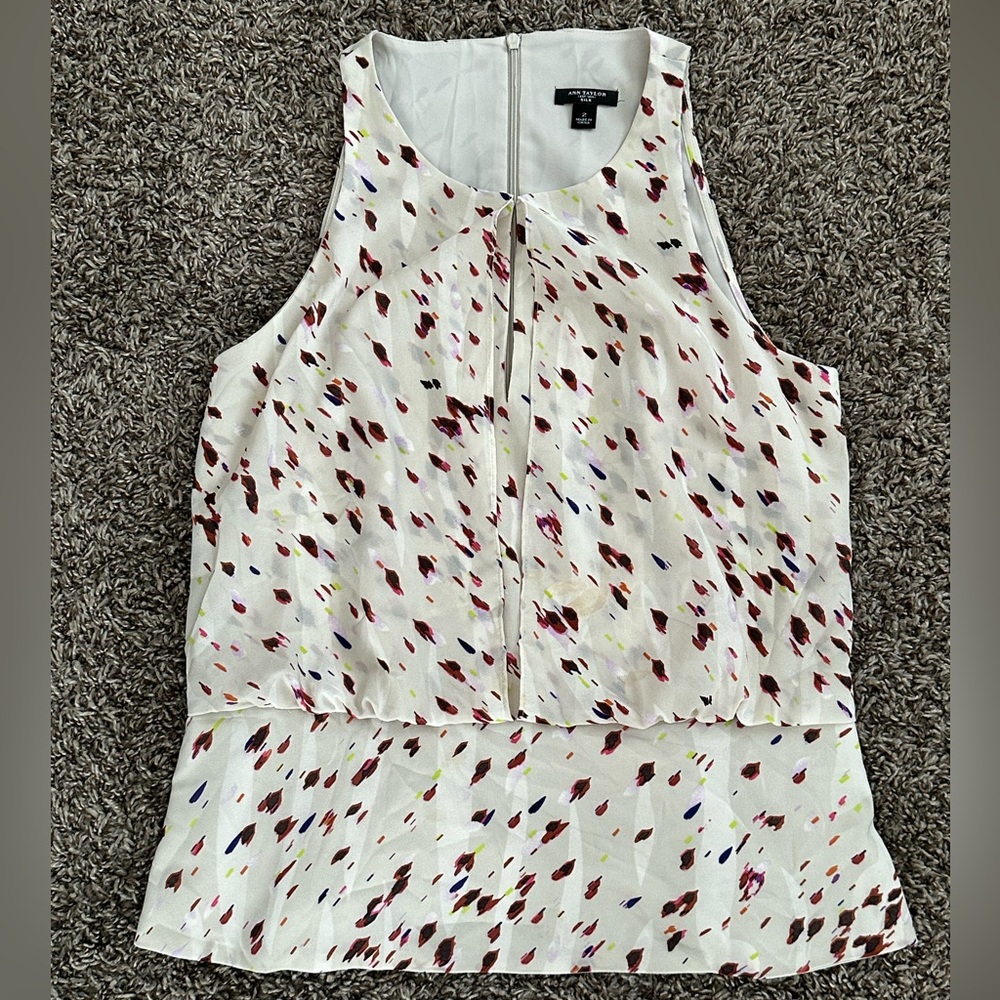 Ann Taylor sleeveless tank with peekaboo cleavage slit. Colorful design.